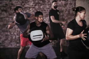 Dynamax Coach Course - group holding the medicine ball
