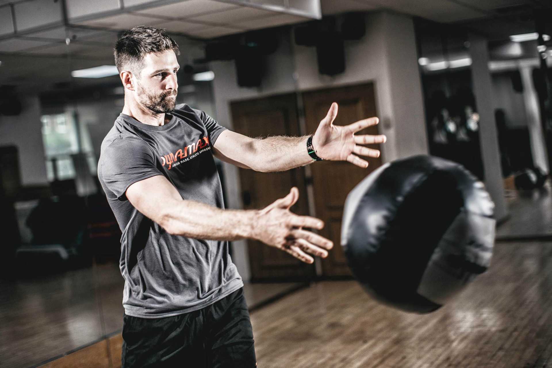 Man Using 14lb Medicine Ball